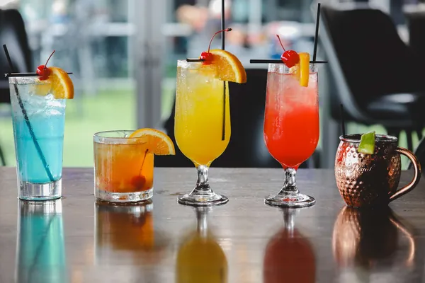 Colorful cocktails garnished with fruit